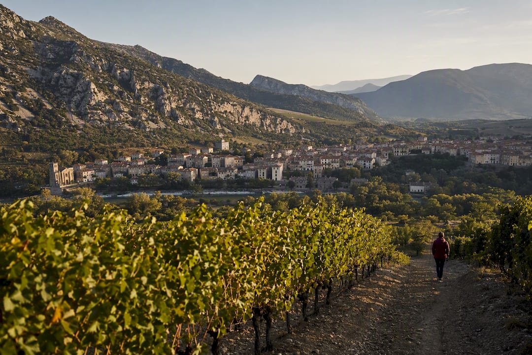 Saint-Paul-de-Fenouillet village beneath rugged Pyrenean hills