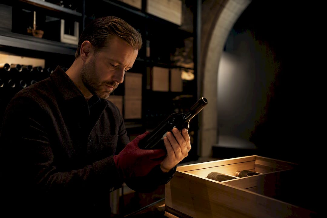 Buyer inspecting anonymous small-batch wine consignment